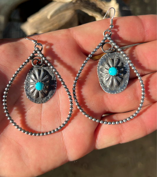 Sterling Silver and sleeping beauty turquoise concho earrings.