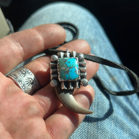 Black bear claw pendant. Sterling silver and Kingman composite turquoise