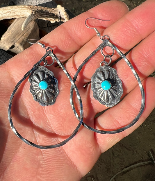 Sterling silver and sleeping beauty turquoise  concho earrings.