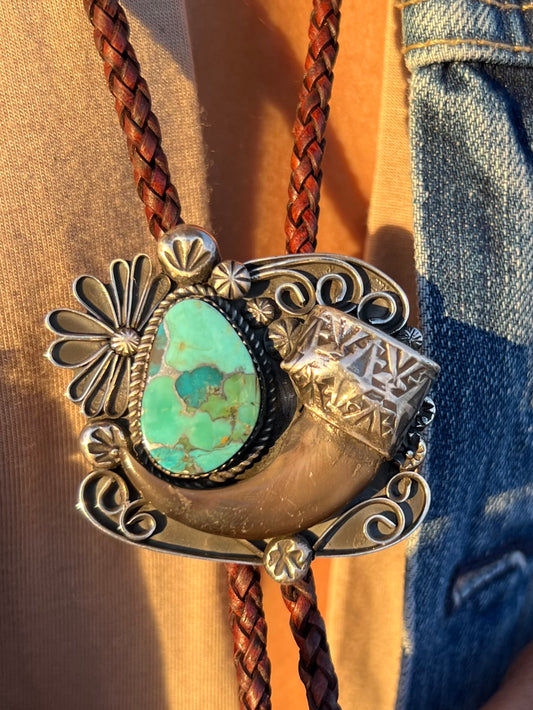 Handmade sterling silver, and Kingman composite turquoise, black bear claw bolo.