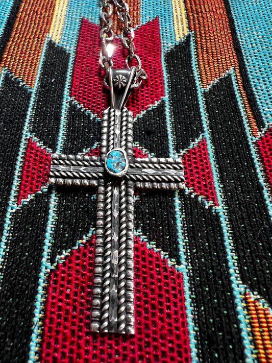Handmade sterling silver cross with Kingman turquoise. Chain sold separately.