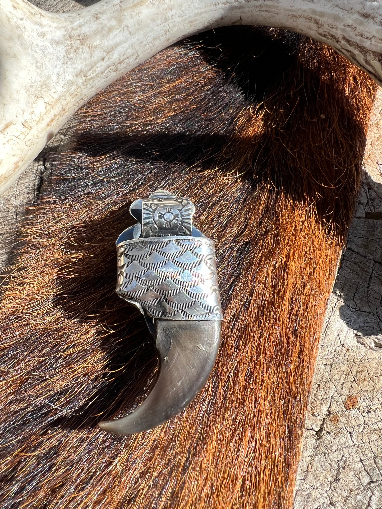 Sterling silver and Tyrone turquoise black bear claw pendant ￼