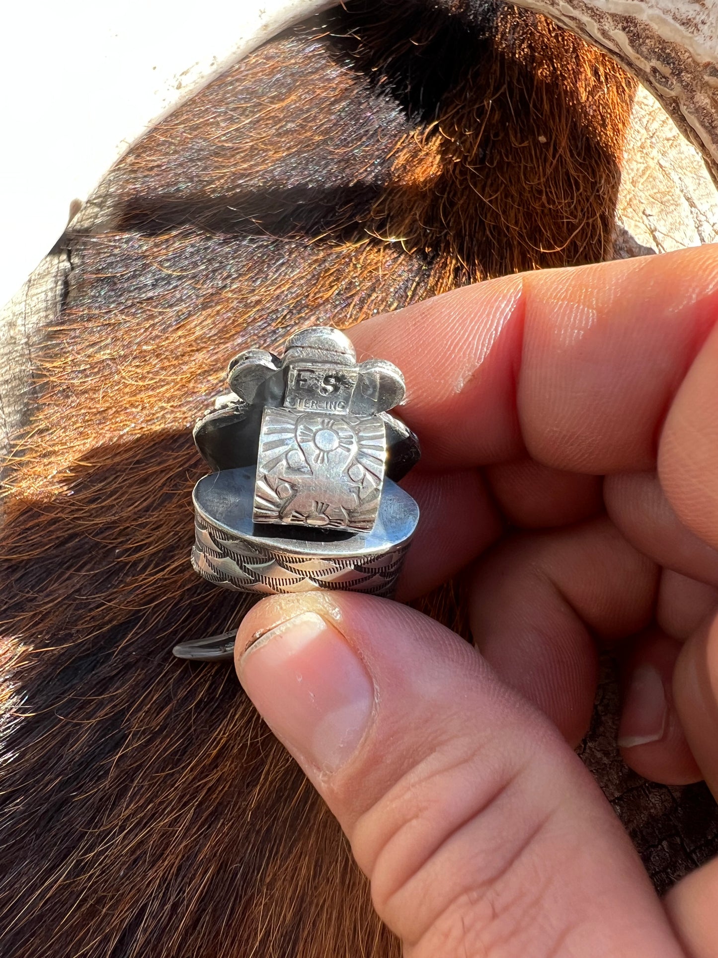 Sterling silver and Tyrone turquoise black bear claw pendant ￼