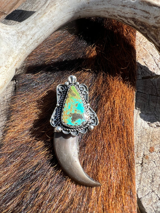 Sterling silver, and Tyrone turquoise blackbear claw pendant ￼