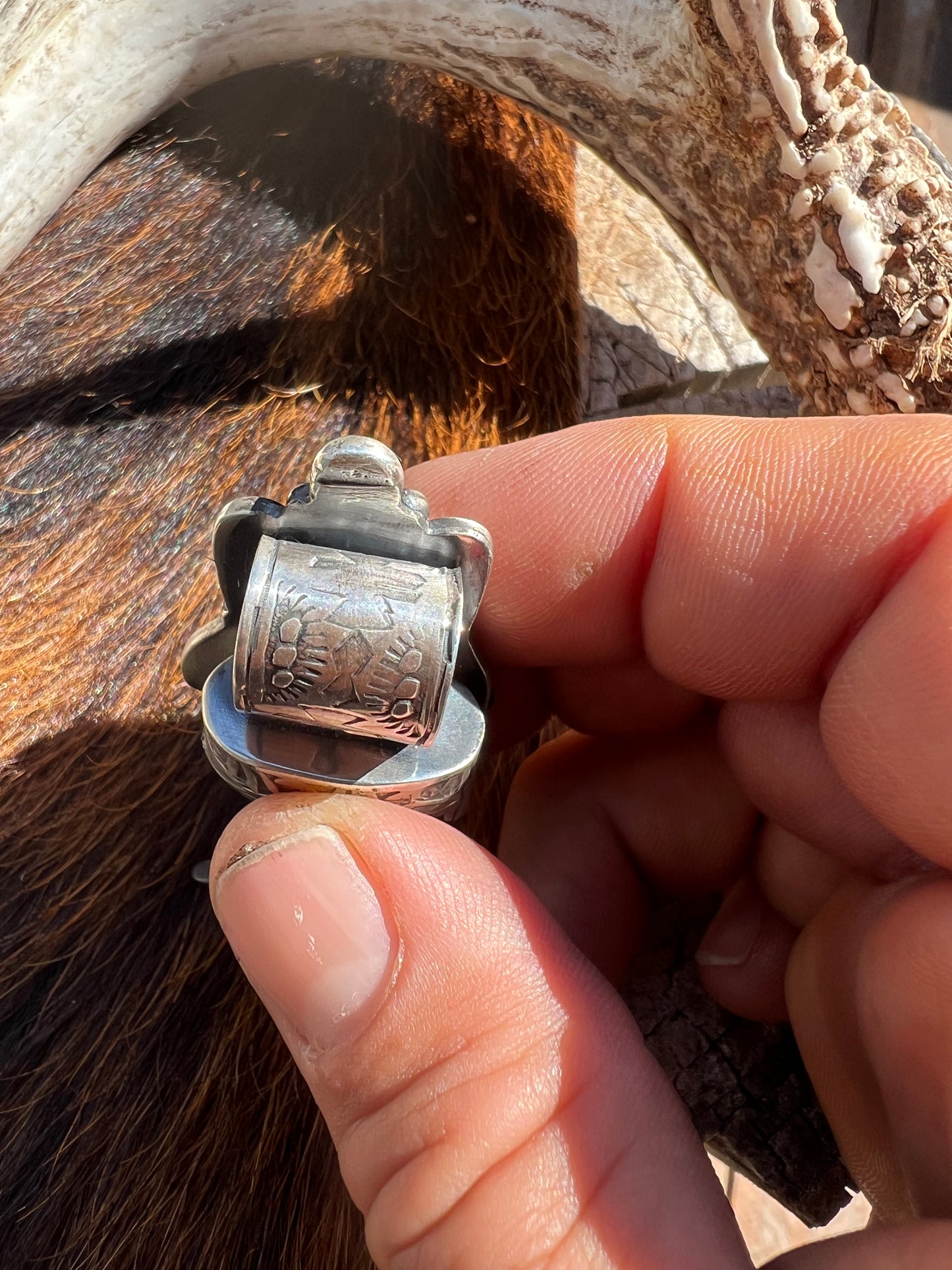 Sterling silver, and Tyrone turquoise blackbear claw pendant ￼