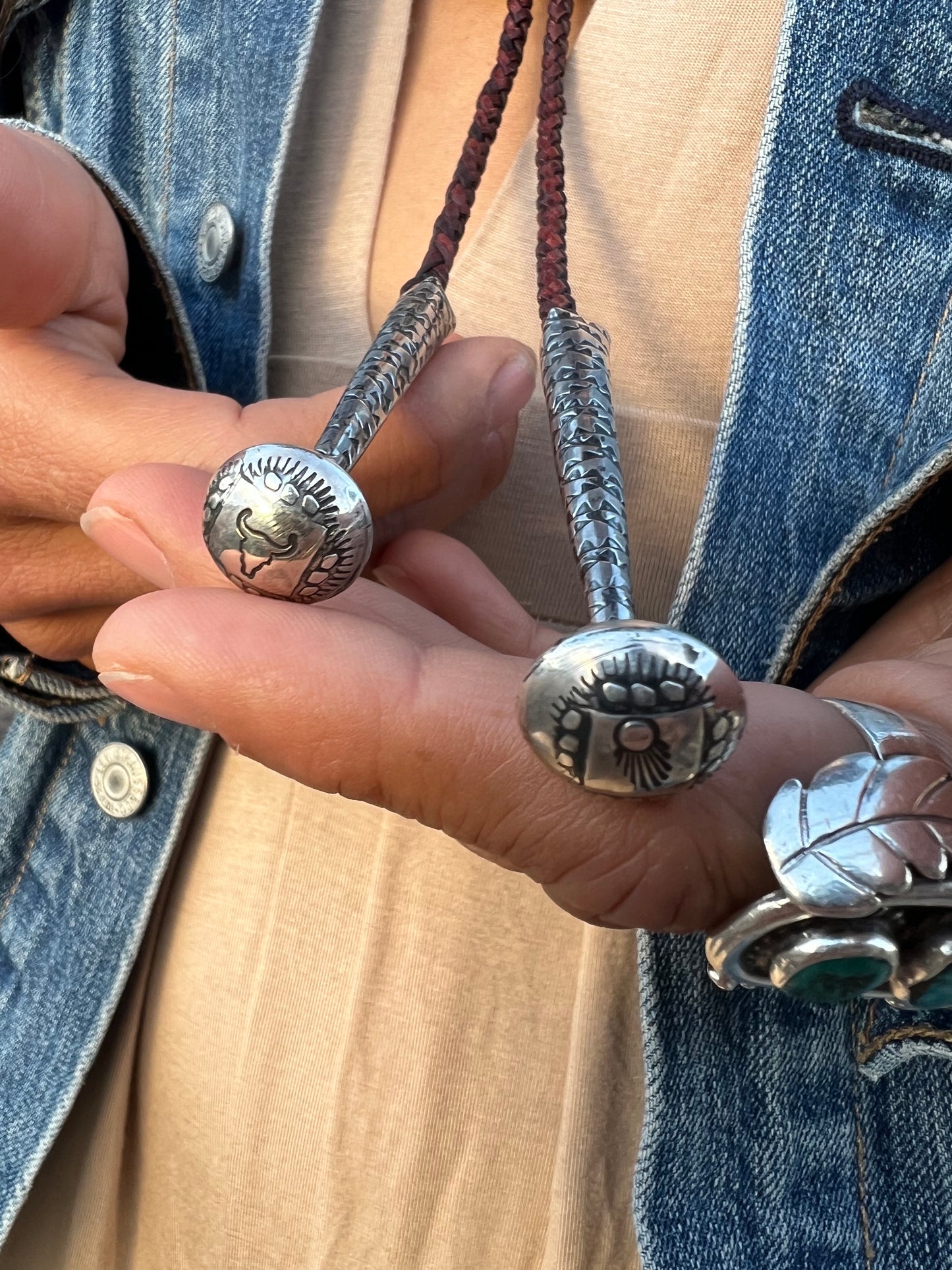 Sterling silver and Royston turquoise black bear claw bolo.