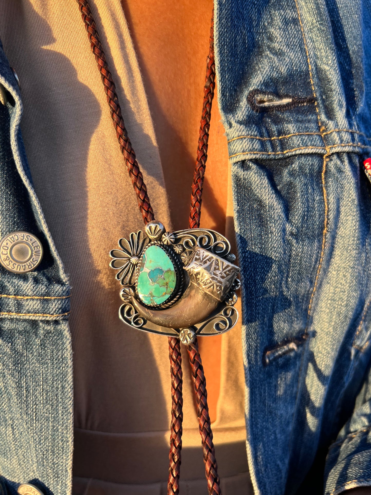 Handmade sterling silver, and Kingman composite turquoise, black bear claw bolo.