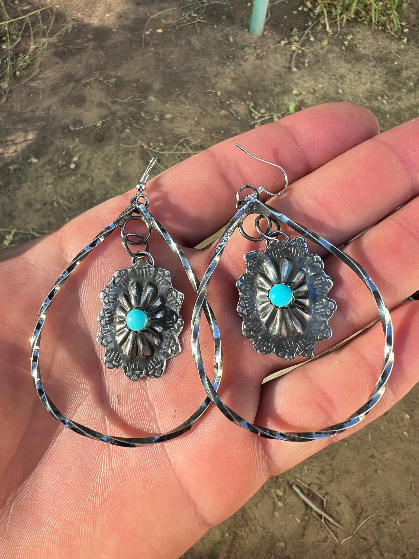 sterling silver and sleeping beauty turquoise concho earrings.