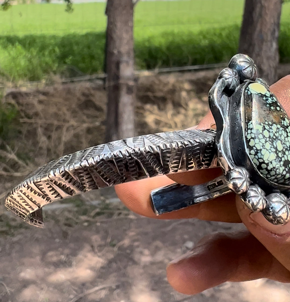 Sterling silver, and Newlanders turquoise cuff.