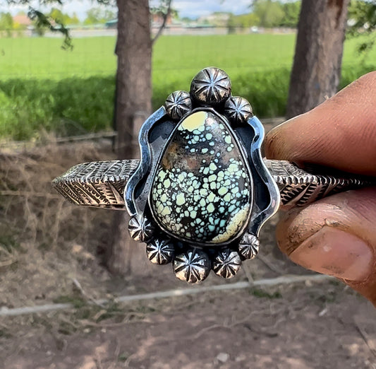 Sterling silver, and Newlanders turquoise cuff.